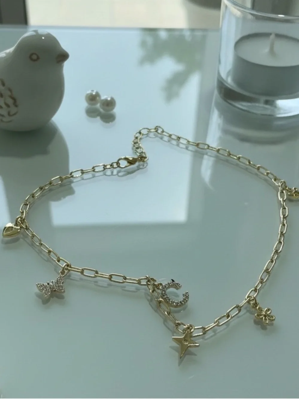 Fine plated necklace with C initial and cuties charm.